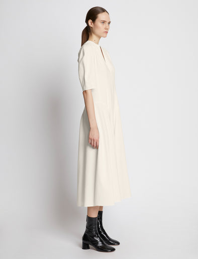 Side full length image of model wearing Cotton Viscose Zip Front Dress in ECRU