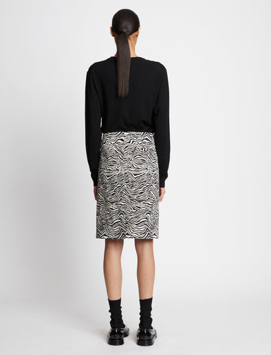 Back full length image of model wearing Eco Superfine Merino Scoop Neck Sweater in BLACK
