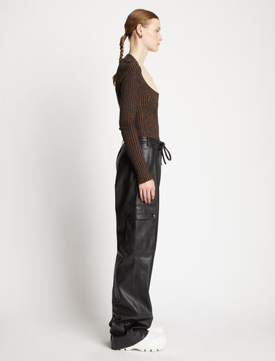 Side full length image of model wearing Faux Leather Drawstring Cargo Pants in BLACK