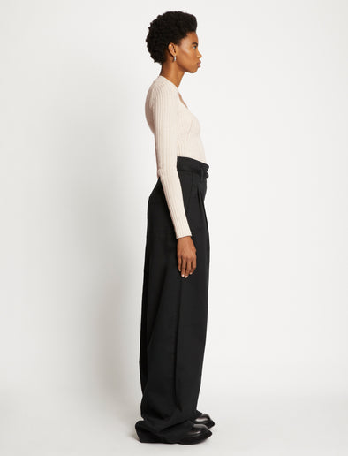 Side full length image of model wearing Plaited Rib Scoop Neck Sweater in BONE/PALE CASHEW