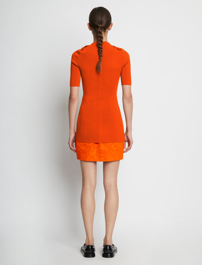 Back full length image of model wearing Compact Viscose Knit Top in TANGERINE