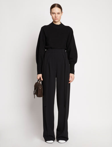 Image of model wearing Suede PS1 Tiny Bag in DARK CHOCOLATE