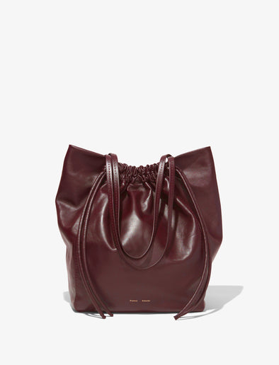 Front image of Drawstring Tote in DARK RED with straps down