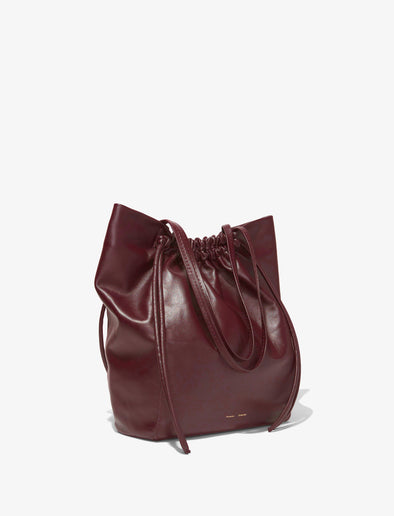 Side image of Drawstring Tote in DARK RED with straps down