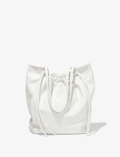 Front image of Drawstring Tote in OPTIC WHITE with straps down
