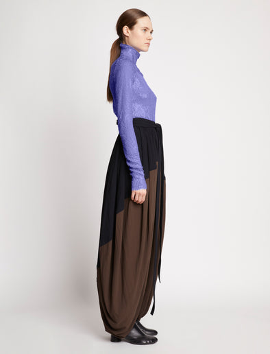 Side full length image of model wearing Faceted Sequin Top in LILAC