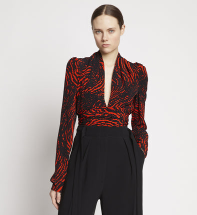 Front cropped image of model wearing Painted Spiral Crepe De Chine V-Neck Top in RED MULTI