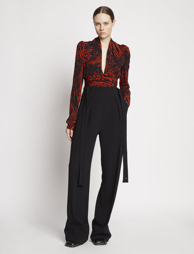 Front full length image of model wearing Painted Spiral Crepe De Chine V-Neck Top in RED MULTI