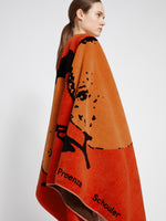 Image of model wearing Orange Beach Towel in LIGHT RED/ORANGE/BLACK