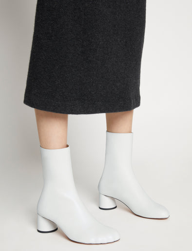 Image of model wearing Sculpt Ankle Boots in White