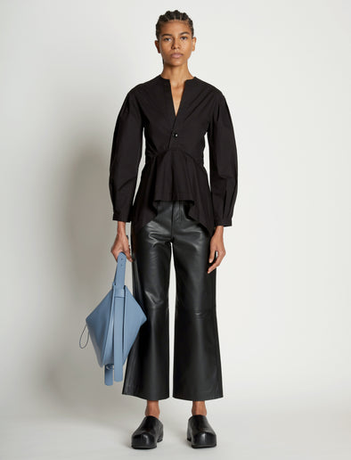 Image of model wearing Baxter Leather Bag in DOVE GREY