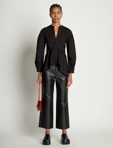 Image of model wearing Small Accordion Flap Bag in VERMILLION