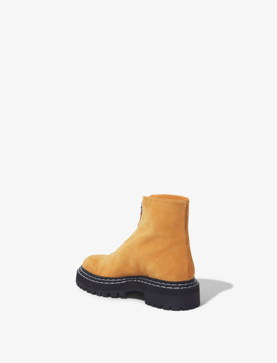 Back 3/4 image of Lug Sole Zip Boots in Light/Pastel Brown