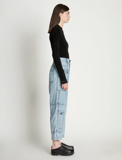Side full length image of model wearing Chambray Pocket Pants in LIGHT INDIGO