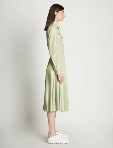 Side full length image of model wearing Faux Leather Tapered Shirt in GREEN TEA