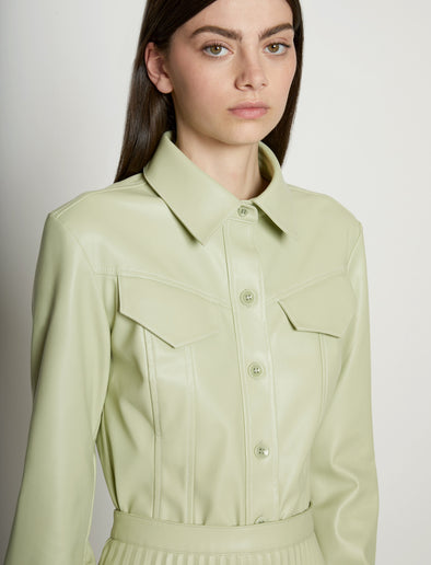 Detail image of model wearing Faux Leather Tapered Shirt in GREEN TEA