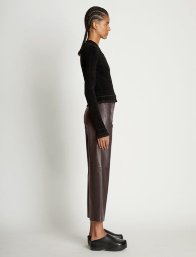 Side full length image of model wearing Cropped Turtleneck Chenille Sweater in BLACK