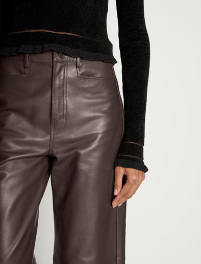 Detail image of model wearing Cropped Turtleneck Chenille Sweater in BLACK