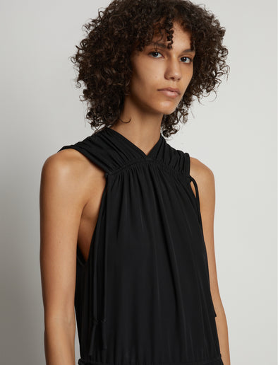Detail image of model wearing Pleatable Crepe Drawstring Dress in BLACK