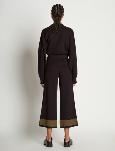Back full length image of model wearing Cashmere Blend Sweatpants in BLACK/DARK SAND
