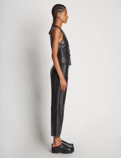 Side full length image of model wearing Leather Vest in BLACK