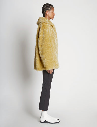 Side full length image of model wearing Faux Rabbit Peacoat in SAND