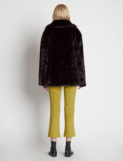 Back full length image of model wearing Faux Rabbit Peacoat in BLACK