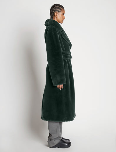 Side full length image of model wearing Faux Fur Belted Coat in PINE