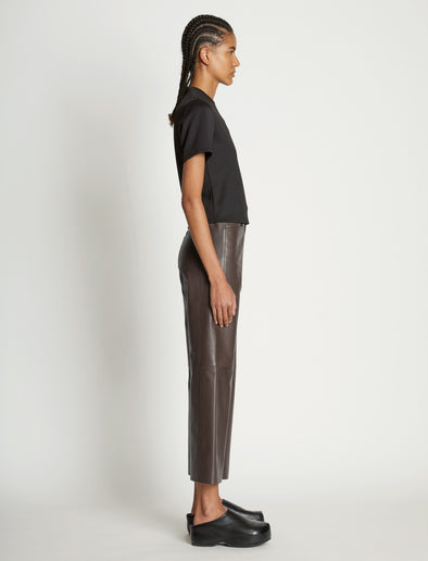Side full length image of model wearing Scuba Short Sleeve Shirt in BLACK