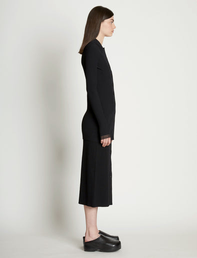 Side full length image of model wearing Rib Knit Fitted Cardigan in BLACK