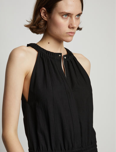 Detail image of model wearing Drapey Suiting Tank Jumpsuit in BLACK