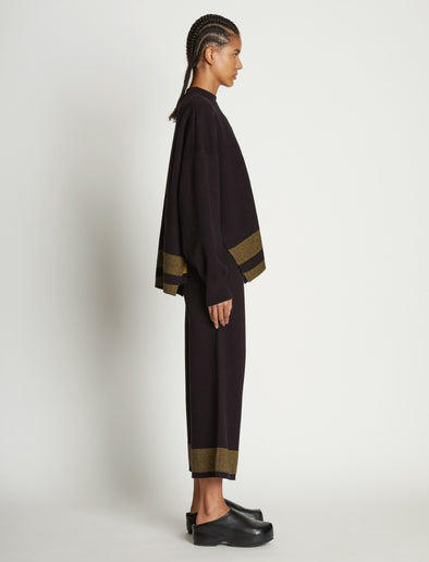 Side full length image of model wearing Cashmere Blend Sweatshirt in BLACK/DARK SAND