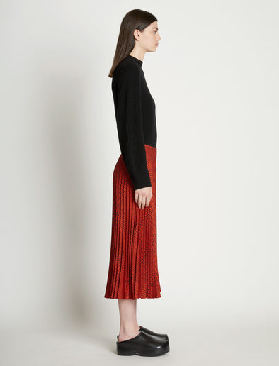 Side full length image of model wearing Pleatable Crepe Midi Skirt
in VERMILLION/BLACK