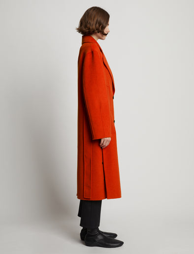 Side full length image of model wearing Melton Double Face Coat in VERMILLION MELANGE