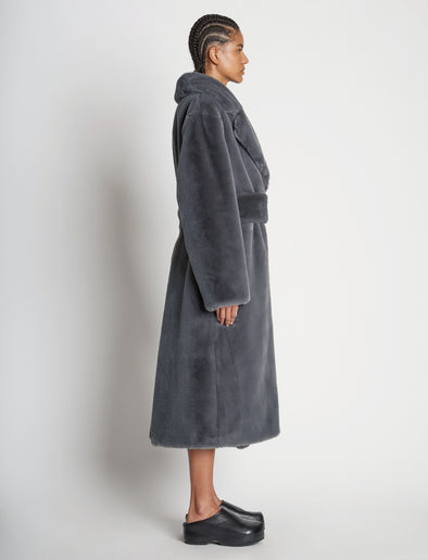 Side full length image of model wearing Faux Fur Belted Coat in DARK GREY