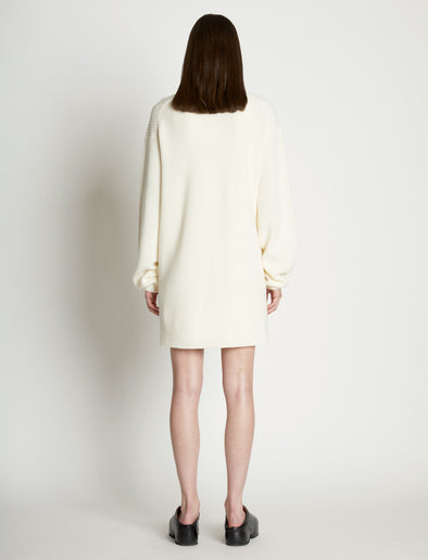 Back full length image of model wearing Cashfeel Cardigan in CREAM