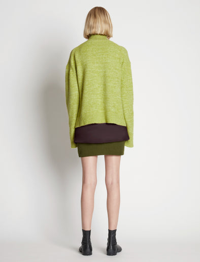 Back full length image of model wearing Fluffy Knit Turtleneck Sweater in AVOCADO/HONEYDEW