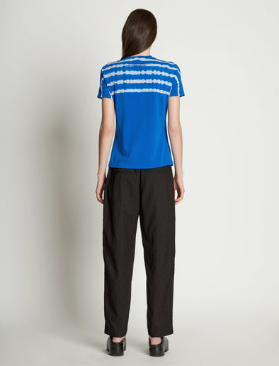 Back full length image of model wearing Tie Dye T-Shirt in BRIGHT BLUE/PERIWINKLE