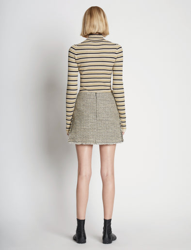 Back full length image of model wearing Stripe Knit Turtleneck in CREAM MULTI
