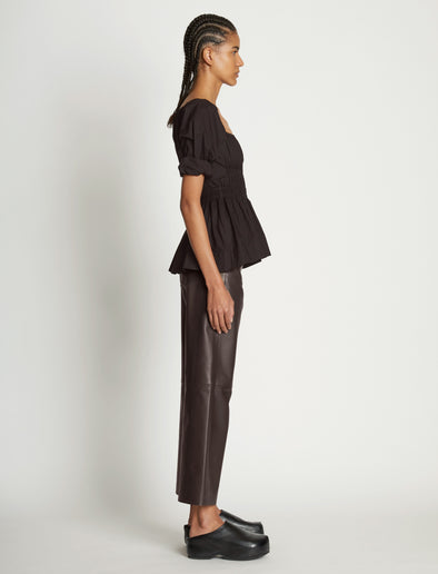 Side full length image of model wearing Square Neck Poplin Top in BLACK