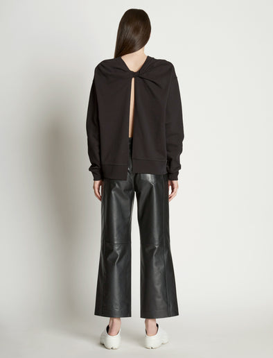 Back full length image of model wearing Long Sleeve Sweatshirt in BLACK