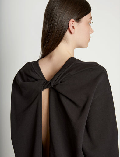 Detail image of model wearing Long Sleeve Sweatshirt in BLACK