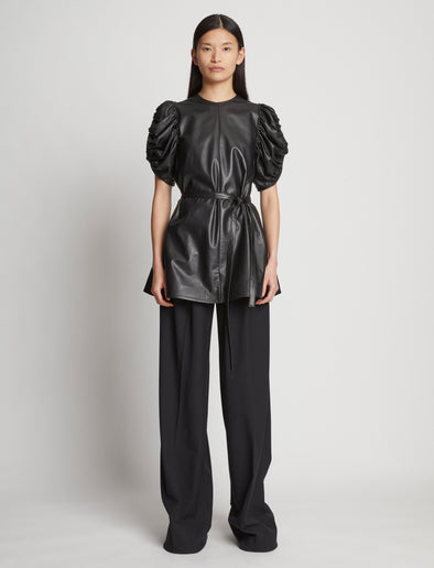 Front full length image of model wearing Leather Belted Top in BLACK