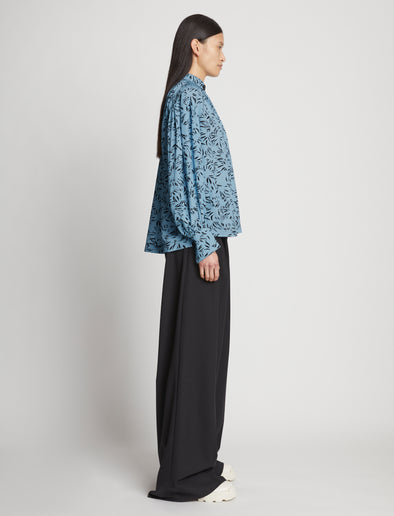 Side full length image of model wearing Printed Crepe De Chine Top in BLUE MULTI