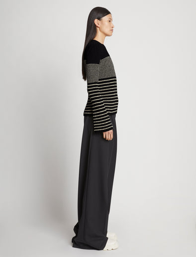 Side full length image of model wearing Boucle Mini Stripe Sweater in BLACK MULTI