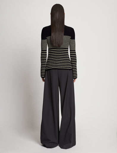 Back full length image of model wearing Boucle Mini Stripe Sweater in BLACK MULTI
