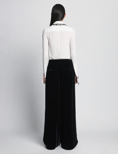Back full length image of model wearing Silk Viscose Velvet Trouser in BLACK