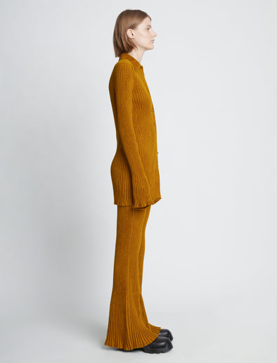 Side full length image of model wearing Velvet Rib Knit Pants in OCHRE