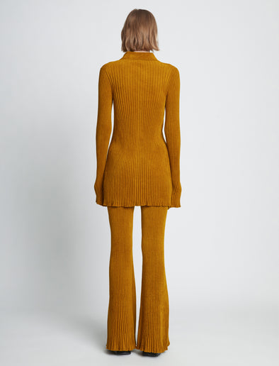 Back full length image of model wearing Velvet Rib Knit Pants in OCHRE
