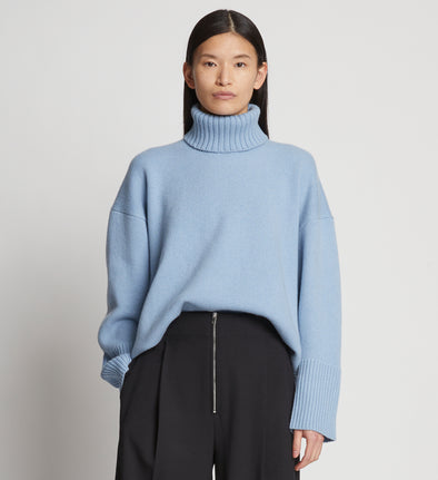 Cropped front image of model wearing Doubleface Cashmere Oversized Turtleneck in light blue